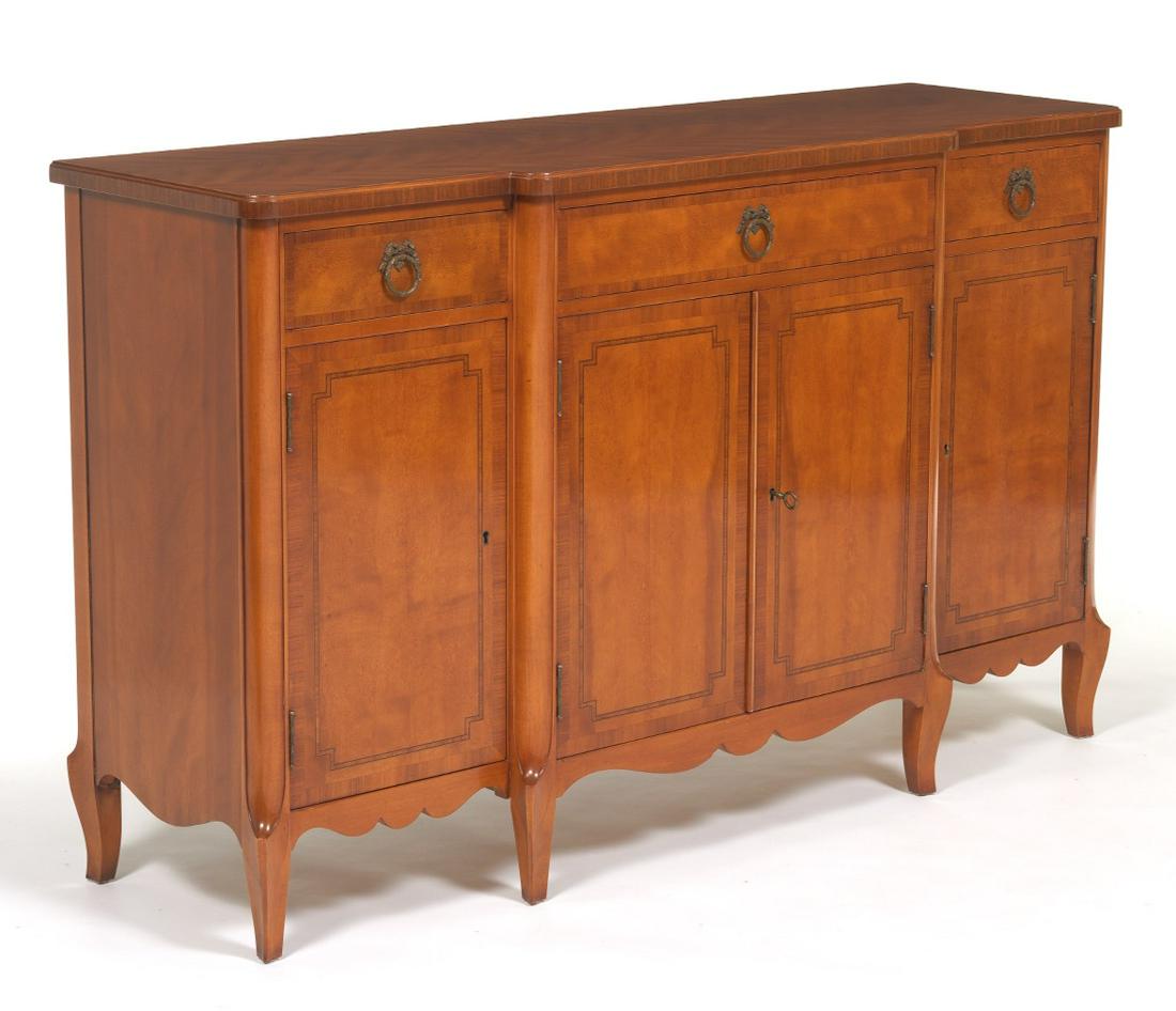 Louis XV Style Buffet with Drawers, by Robert Irwin: 33-1/4" x 54" x 17" Louis XV style step-front buffet with three drawers over hinged and paneled doors, scalloped apron and short cabriole feet. Original key present. View and Bid on