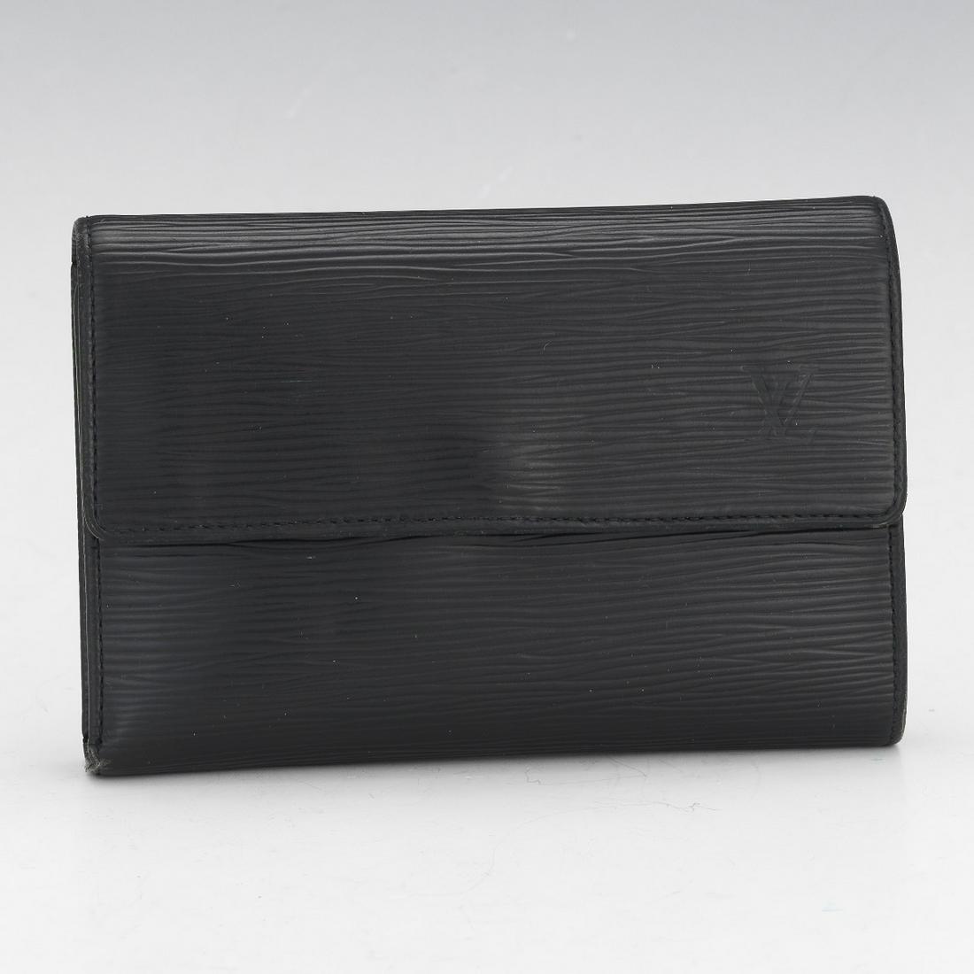 Louis Vuitton Black Epi Leather Sarah Wallet: 4" x 6-1/4" x 1" Black Epi leather, eight card slots, one coins compartment with snap button closure, two paper bill compartments. View and Bid on AspireAuctions.com