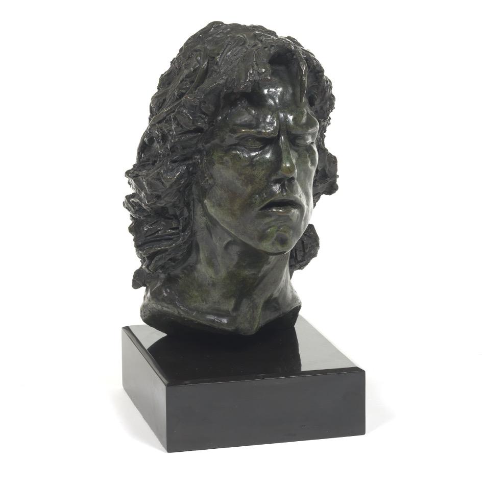 Carlo D'Alessio (Contemporary): 16" x 8" x 11" without base; 19" with base Head of a Young Man, 1981. Bronze on black marble stand. Signed and dated.