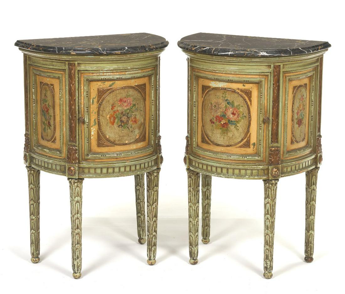 Italian Pair of Hand Painted Demilune Tables with: 31a€T x 19-7/8a€W x 14a€D Demilune form marble top single door cabinet with hand painted polychrome floral-foliate and garland design and gesso decoration.