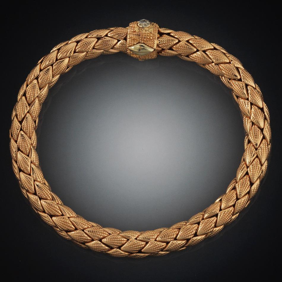 Chimento Italian Tri-Color Gold and Diamond Braided: 7-7/8" x 1/2" at the widest point 18k tri-color gold textured finish braided flex bangle bracelet with clip-in clasp, accented with round brilliant cut diamond, total estimated diamond weight 0.03 ct,