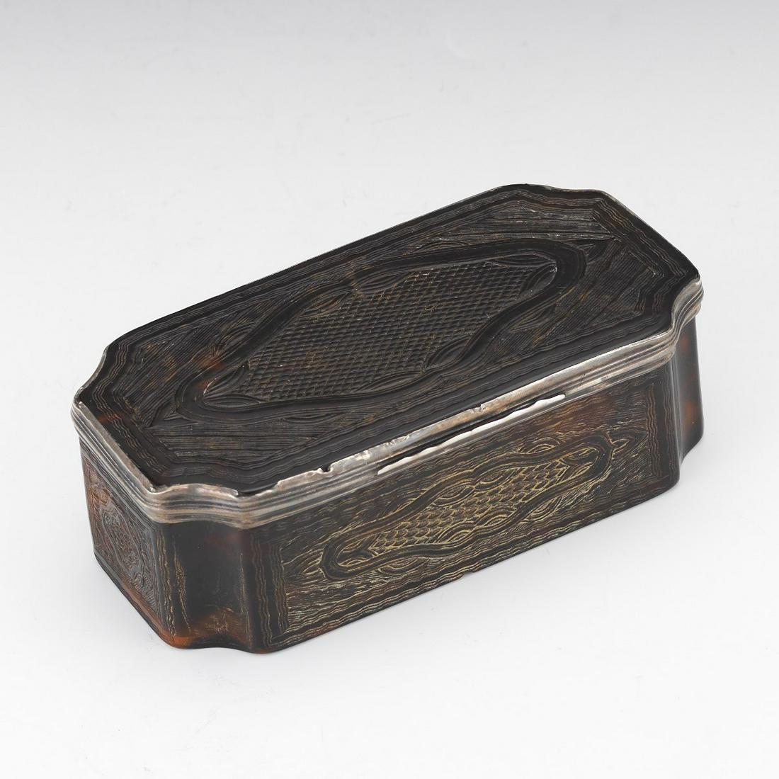 George III / Victorian Silver and Tortoise Shell Tabatière, ca. 19th Century: 4-1/2" x 2-3/8" x 1-1/2" Elongated octagonal tabatière with convex canted corners, finely hand carved tortoise shell with hinged lid, silver fittings, cartouches, waves, and diamond carved design