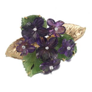 Russell Trusso Carved Amethyst, Jade and Diamond Pansy Brooch: 2-1/4"L x 1-1/2"W 18k yellow gold mounted brooch feature six carved amethyst pansies, each set with round cut diamonds, further accented with jade leaves; overall weight 23 gm.