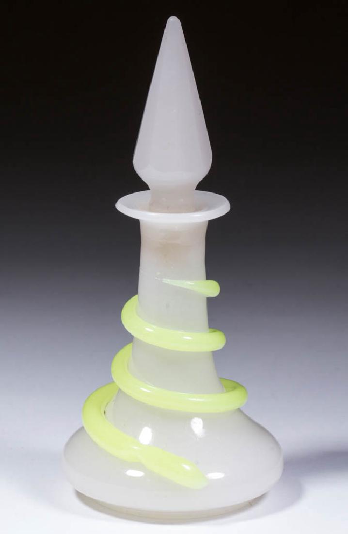 BLOWN-MOLDED SNAKE ENTWINED COLOGNE BOTTLE: BLOWN-MOLDED SNAKE ENTWINED COLOGNE BOTTLE, alabaster/clambroth with translucent yellow/green (black lighted), tapered, wide-base form with flanged mouth, raised on a slight foot with partially polish