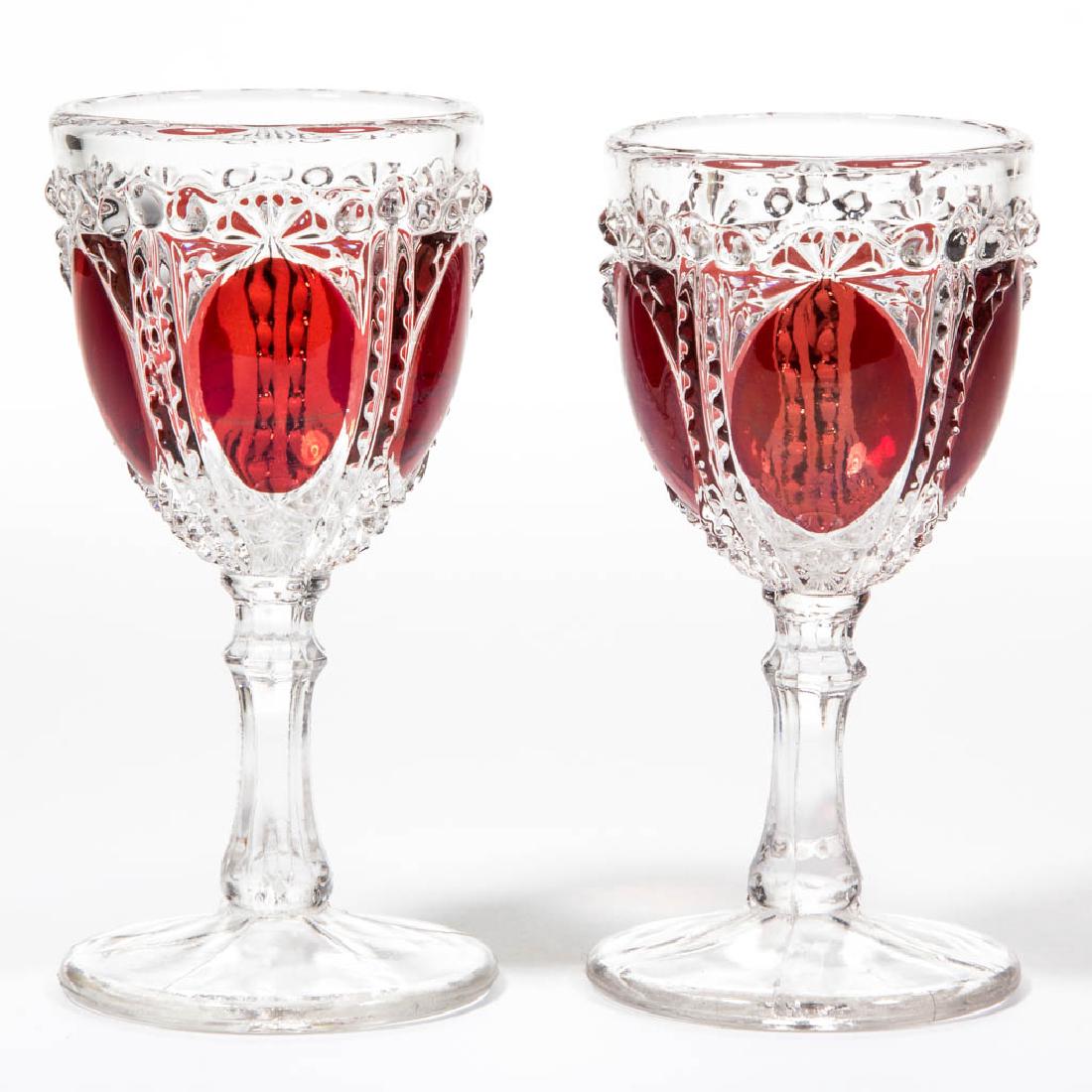 PENTAGON - RUBY-STAINED WINES, LOT OF TWO: PENTAGON - RUBY-STAINED WINES, LOT OF TWO, colorless. Maker unidentified. Circa 1890. 4 3/8" H.Undamaged.Literature: Heacock - Book 7: Ruby-Stained Glass From A to Z, p. 63, fig. 869.Provenance: From