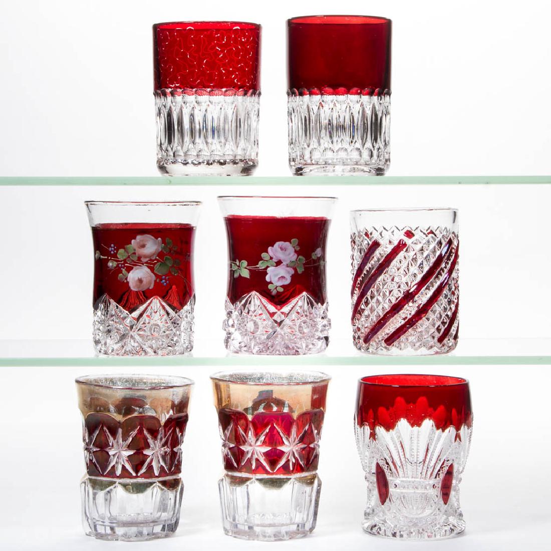 ASSORTED EAPG - RUBY-STAINED TUMBLERS, LOT OF EIGHT: ASSORTED EAPG - RUBY-STAINED TUMBLERS, LOT OF EIGHT, colorless, including two Mario, a Prince of Wales, and two Mirror Star examples. Various makers. Fourth quarter 19th/first quarter 20th century. 3