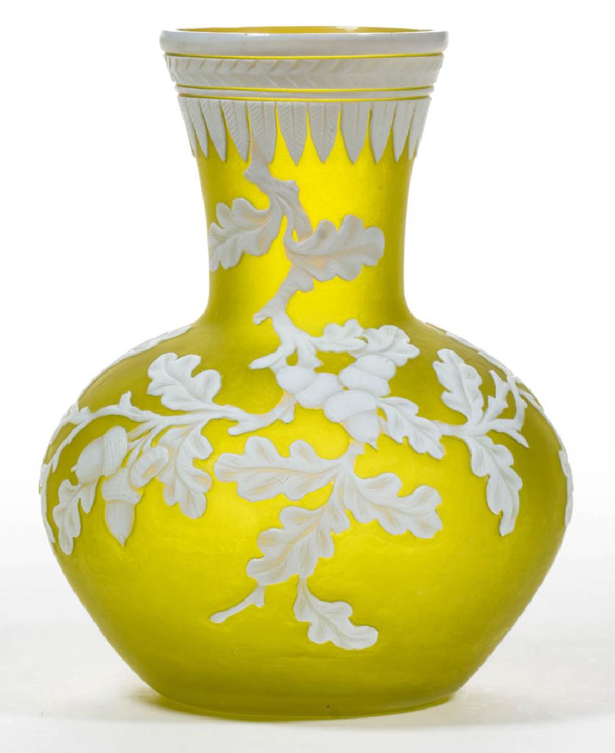 ENGLISH CAMEO ART GLASS VASE: ENGLISH CAMEO ART GLASS VASE, white to Citron, acorn motif with a cut-feather band to the mouth, factory-polished base and pontil mark. Probably Thomas Webb & Sons. Fourth quarter 19th century. 6 1/2"
