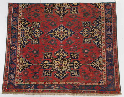 STAR USHAK RUG/CARPET FRAGMENT: STAR USHAK RUG/CARPET FRAGMENT, red field with green leaf and flowering vine design throughout, deep blue medallions centered and along edge of field, with entwining vines in cream, blue primary borde