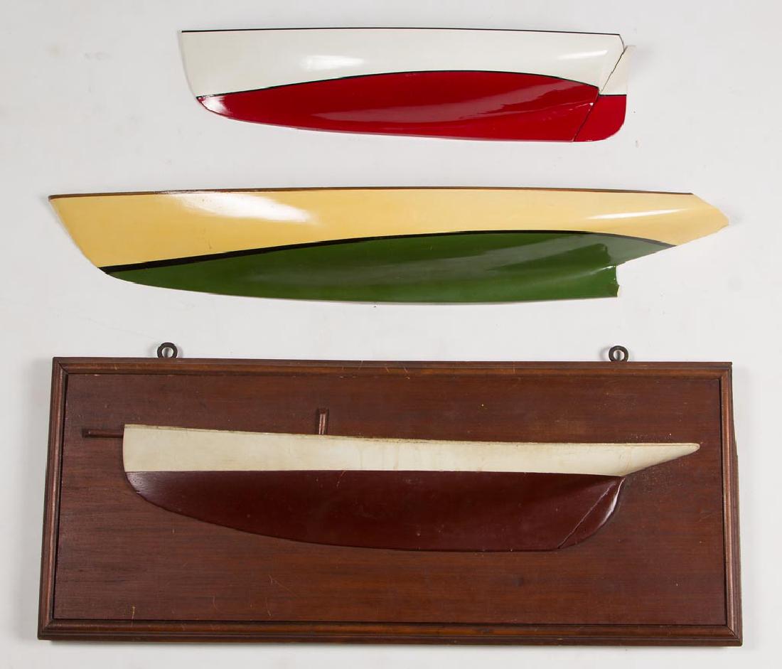 WINSLOW ANDERSON (AMERICAN, 1917-2007) HALF-HULL SHIP: WINSLOW ANDERSON (AMERICAN, 1917-2007) HALF-HULL SHIP MODELS, LOT OF THREE, green-painted example, likely plaster, inscribed "Designed and Made by Winslow Anderson" to reverse, smaller red-and white-p