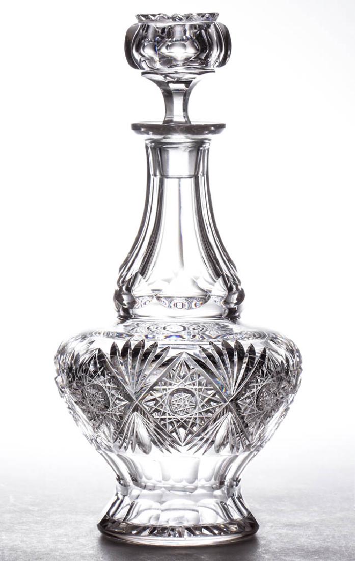 PAIRPOINT "UNCATENA" VARIANT BRILLIANT CUT GLASS: PAIRPOINT "UNCATENA" VARIANT BRILLIANT CUT GLASS DECANTER, lacking the flashing to the fans and a variance in the center of hobstar, globular and footed form, hobstars alternating with fans over elong