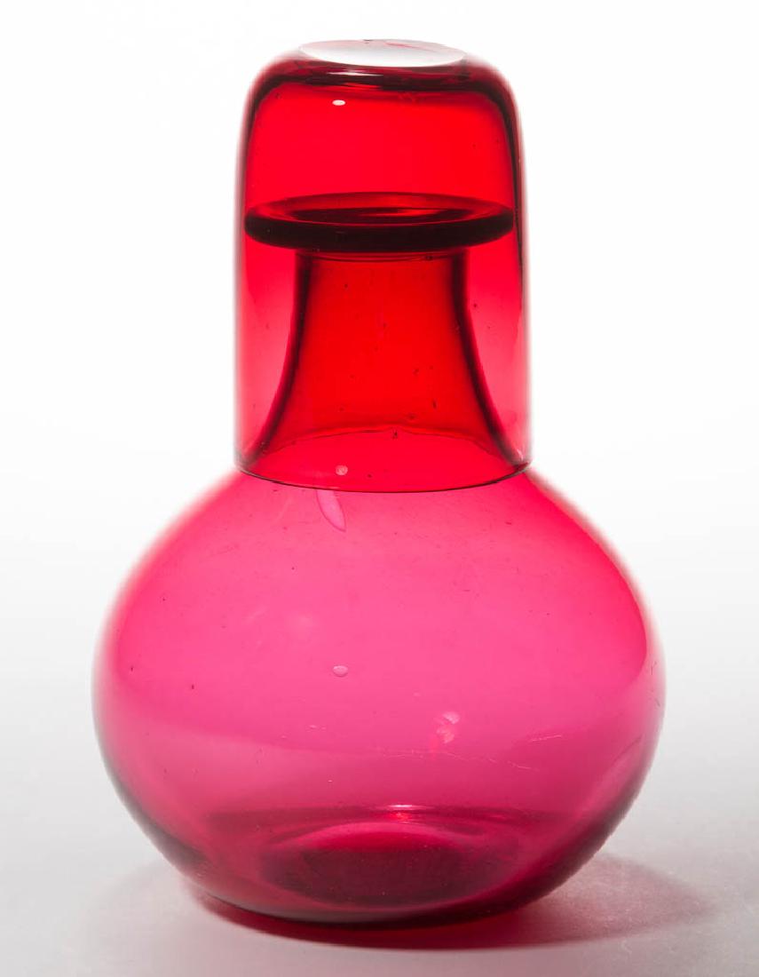 FREE-BLOWN TUMBLE-UP: FREE-BLOWN TUMBLE-UP, ruby-cased, pyriform bottle with flanged mouth and polished pontil mark, correct cylindrical tumbler with rounded base and polished pontil mark. Very well fitting and matching. S