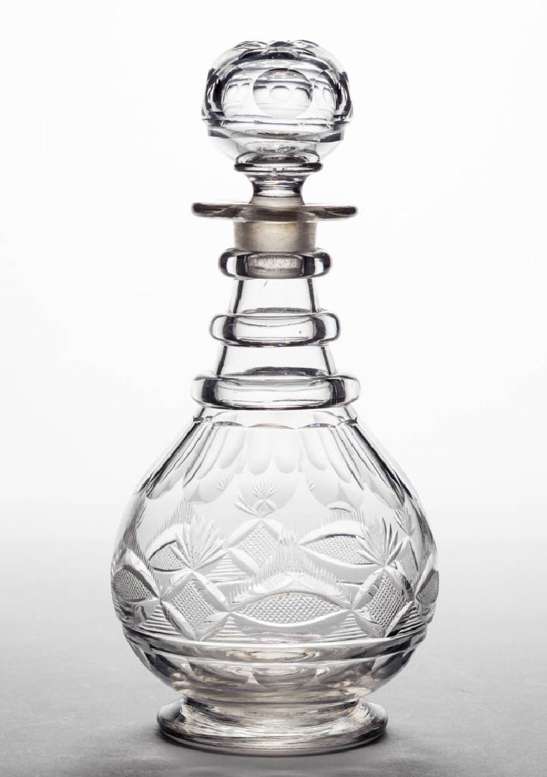 CUT STRAWBERRY DIAMOND, FAN, AND VESICA WITH RAYS PINT: CUT STRAWBERRY DIAMOND, FAN, AND VESICA WITH RAYS PINT DECANTER, colorless, squat bulbous form with shoulder panels and three applied neck rings, raised on a sloping foot with polished pontil mark, we