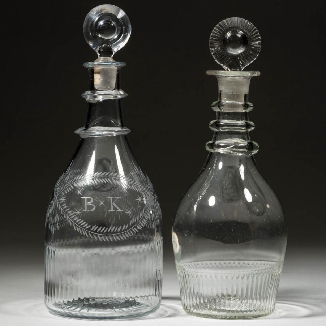 DIP-MOLDED QUART DECANTERS, LOT OF TWO: DIP-MOLDED QUART DECANTERS, LOT OF TWO, colorless, broad-base taper and Prussian forms, one with two neck rings and engraved undulating intersecting vines, a bird, stars, and "B K", other with three n