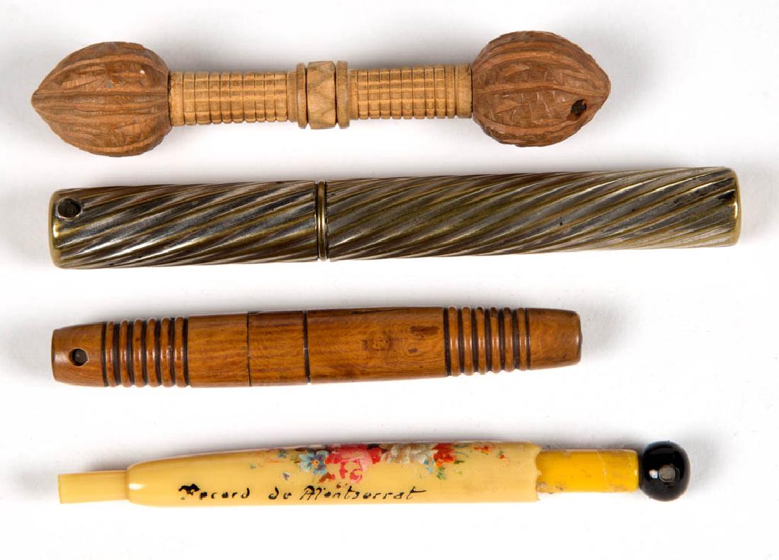 ASSORTED NEEDLE CASES, LOT OF FOUR: ASSORTED NEEDLE CASES, LOT OF FOUR, comprising a silvered-brass example, a celluloid/plastic example, and two carved wood examples, each with stanhope. Second half 19th/early 20th century. 3 3/8" to 4