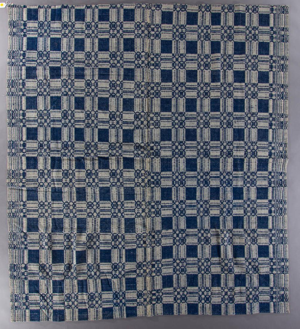 VIRGINIA GEOMETRIC OVERSHOT COVERLET: VIRGINIA GEOMETRIC OVERSHOT COVERLET, blue, natural, having linen warp and wool weft, with pattern variation on selvedge edge as a border design, rolled, hemmed ends and natural selvedge edge, in two