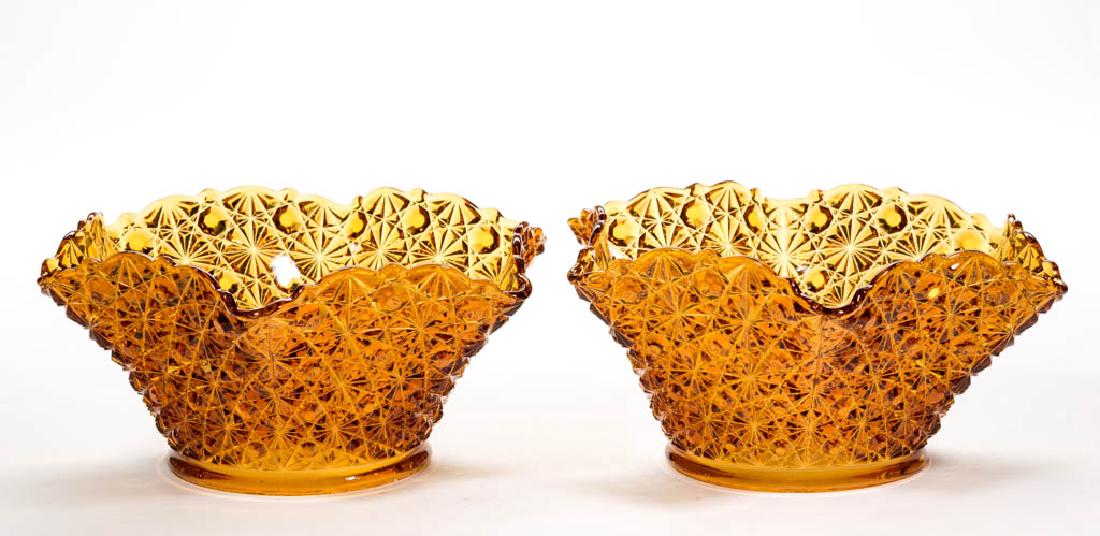 DAISY AND BUTTON PAIR OF GAS LAMP SHADES: DAISY AND BUTTON PAIR OF GAS LAMP SHADES, amber. Late 19th/early 20th century. 4 1/2" H, 4 3/4" D fitters. Undamaged with one having typical minute roughness to the fitter, as made. Provenance: Proper