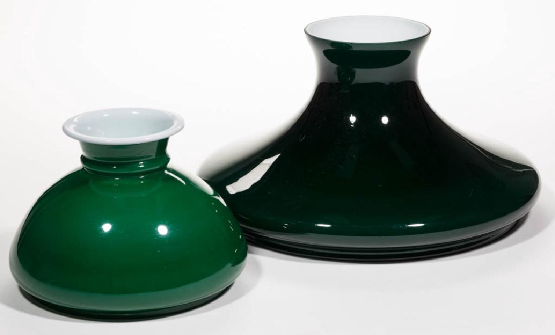 EMERALITE CASED GLASS STUDENT LAMP SHADES, LOT OF TWO: EMERALITE CASED GLASS STUDENT LAMP SHADES, LOT OF TWO, cased teal green, comprising a tam-o-shanter and a domed example. First quarter 20th century. 7 1/4" H, 11 7/8" D fitter tam-o-shanter, 5 3/4" H,