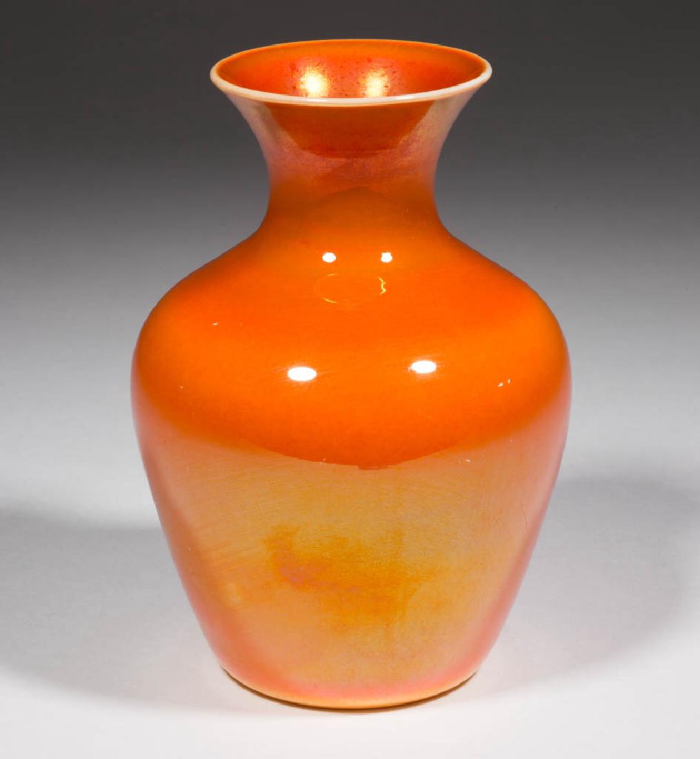 IMPERIAL LEAD LUSTRE VASE: IMPERIAL LEAD LUSTRE VASE, orange exterior, opaque white interior, polished pontil mark. Imperial Glass Co. Circa 1925. 6 3/8" H. Undamaged with scattered minute nicking to the exterior. Provenance: F