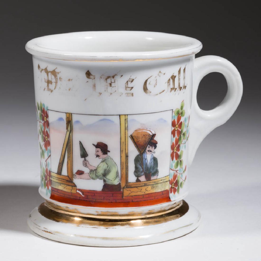BRICKMASON'S OCCUPATIONAL SHAVING MUG: BRICKMASON'S OCCUPATIONAL SHAVING MUG, hand-painted scene of two figures with tools at work on a wall, gilt-lettered owner's name, printed mark for August Kern Barber Supply Co., St. Louis, Missouri t
