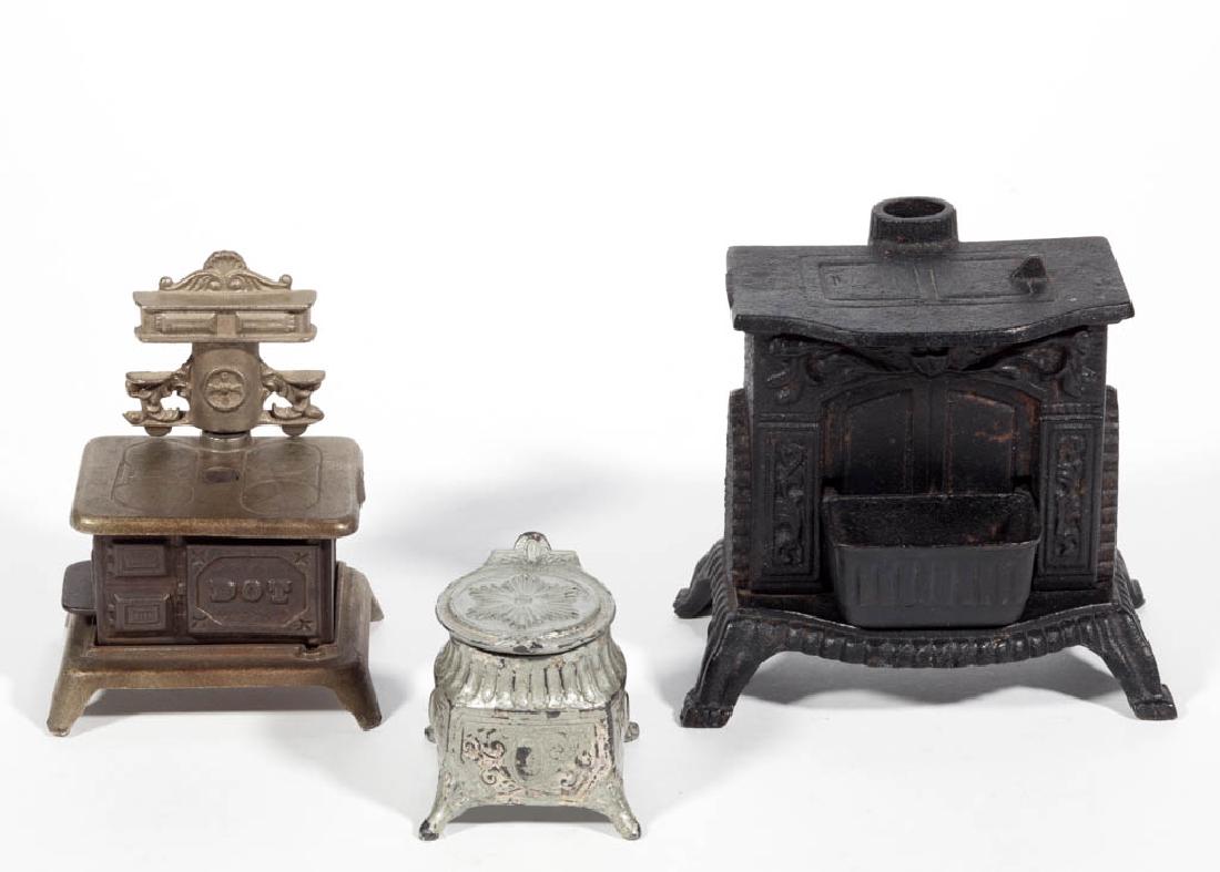 CAST-IRON TOY STOVE BANKS, LOT OF TWO (1 of 1)