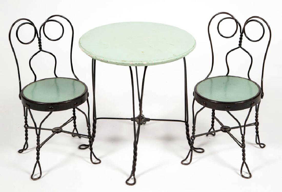 VINTAGE CHILD'S ICE CREAM PARLOR TABLE AND TWO CHAIRS