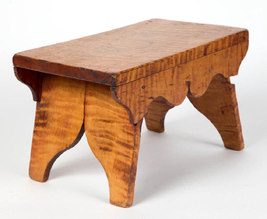 CARVED TIGER MAPLE FOOT STOOL (1 of 2)