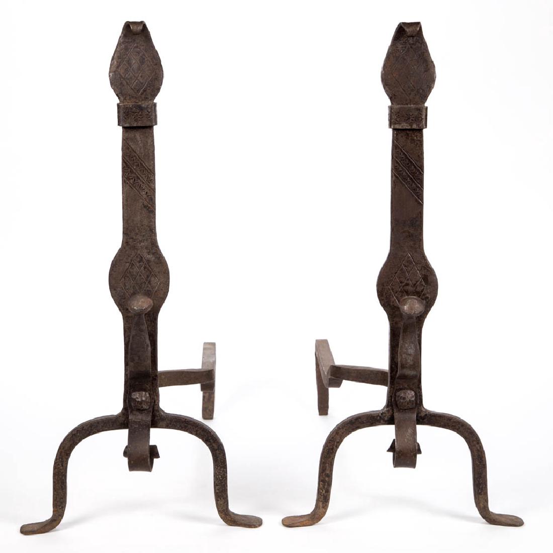 PAIR OF WROUGHT-IRON ANDIRONS: PAIR OF WROUGHT-IRON ANDIRONS, whimsical knife-blade form with tooled decoration, all raised on cabriole legs ending in padded feet. First half 20th century. 23 1/2" HOA, 21" DOA. Excellent overall co