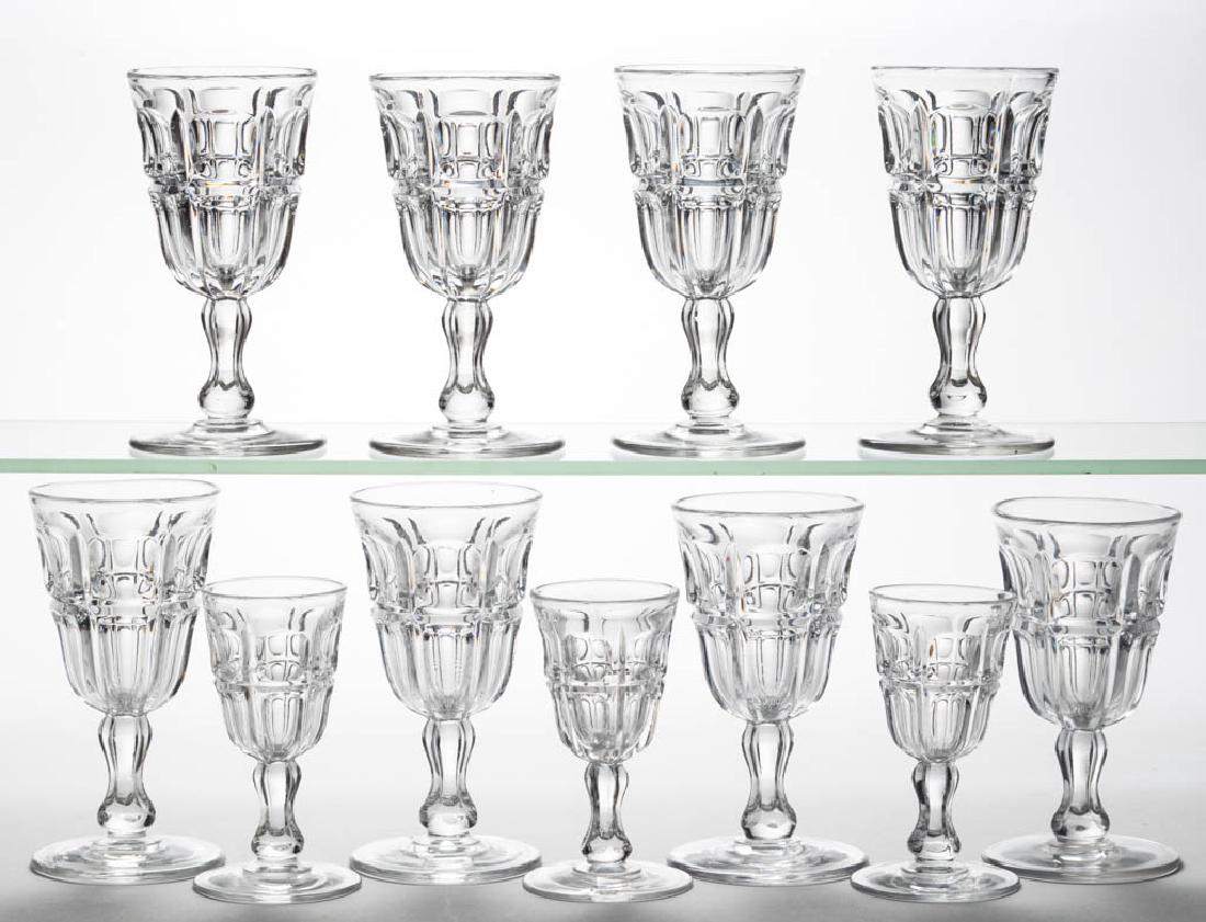 BIGLER - GROOVED DRINKING ARTICLES, LOT OF 11: BIGLER - GROOVED DRINKING ARTICLES, LOT OF 11, colorless lead glass, comprising eight champagnes, and three wines; each with a polished pontil mark. Third quarter 19th century. 4 1/4" to 5 1/2" H. Thr