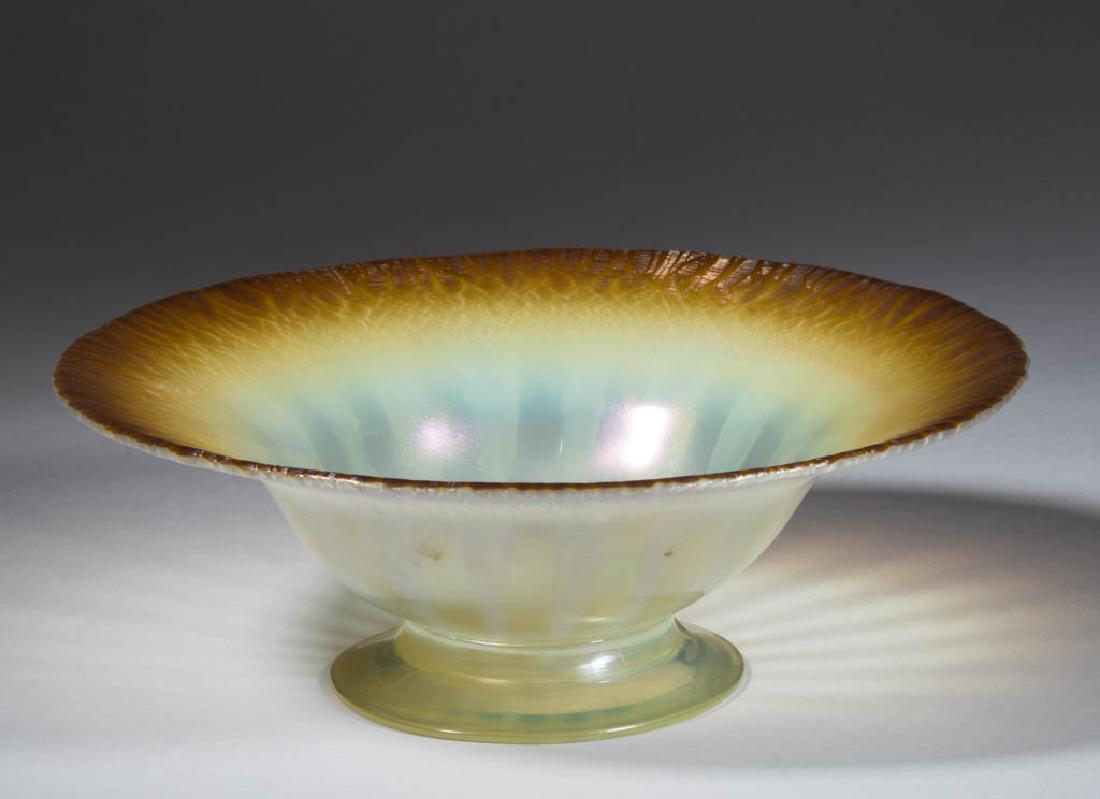 TIFFANY FAVRILE PASTEL ART GLASS FOOTED BOWL: TIFFANY FAVRILE PASTEL ART GLASS FOOTED BOWL, canary opalescent with shaded deep amber rim, large flaring bowl with an applied circular foot, polished pontil mark, signed, "1589 - L.C.Tiffany - Favril