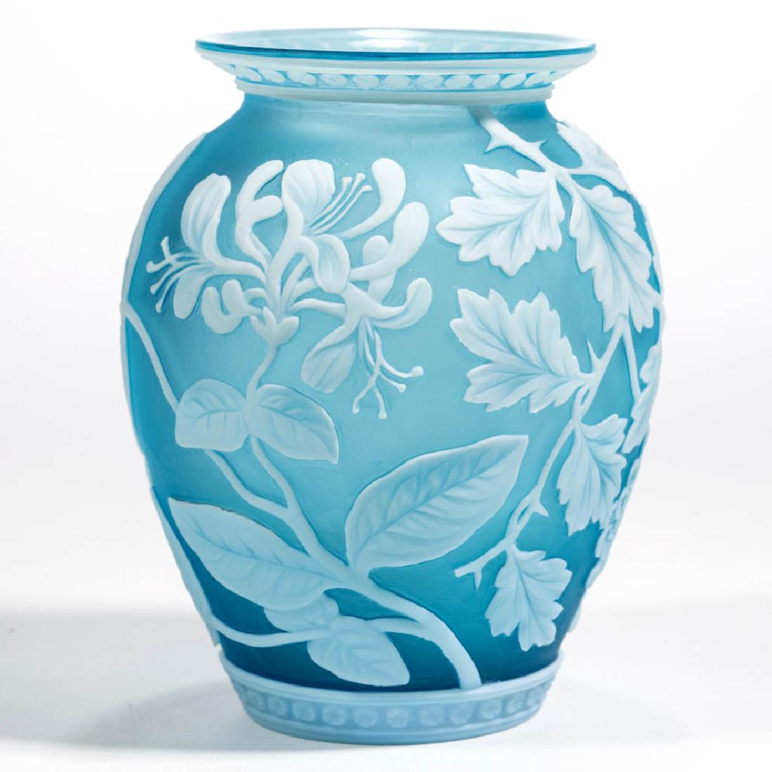 THOMAS WEBB ATTRIBUTED CAMEO ART GLASS VASE: THOMAS WEBB ATTRIBUTED CAMEO ART GLASS VASE, white to blue, urn form, honeysuckle design with bands of crossed beads to the rim and base, factory-polished table ring and pontil mark. Thomas Webb & Son