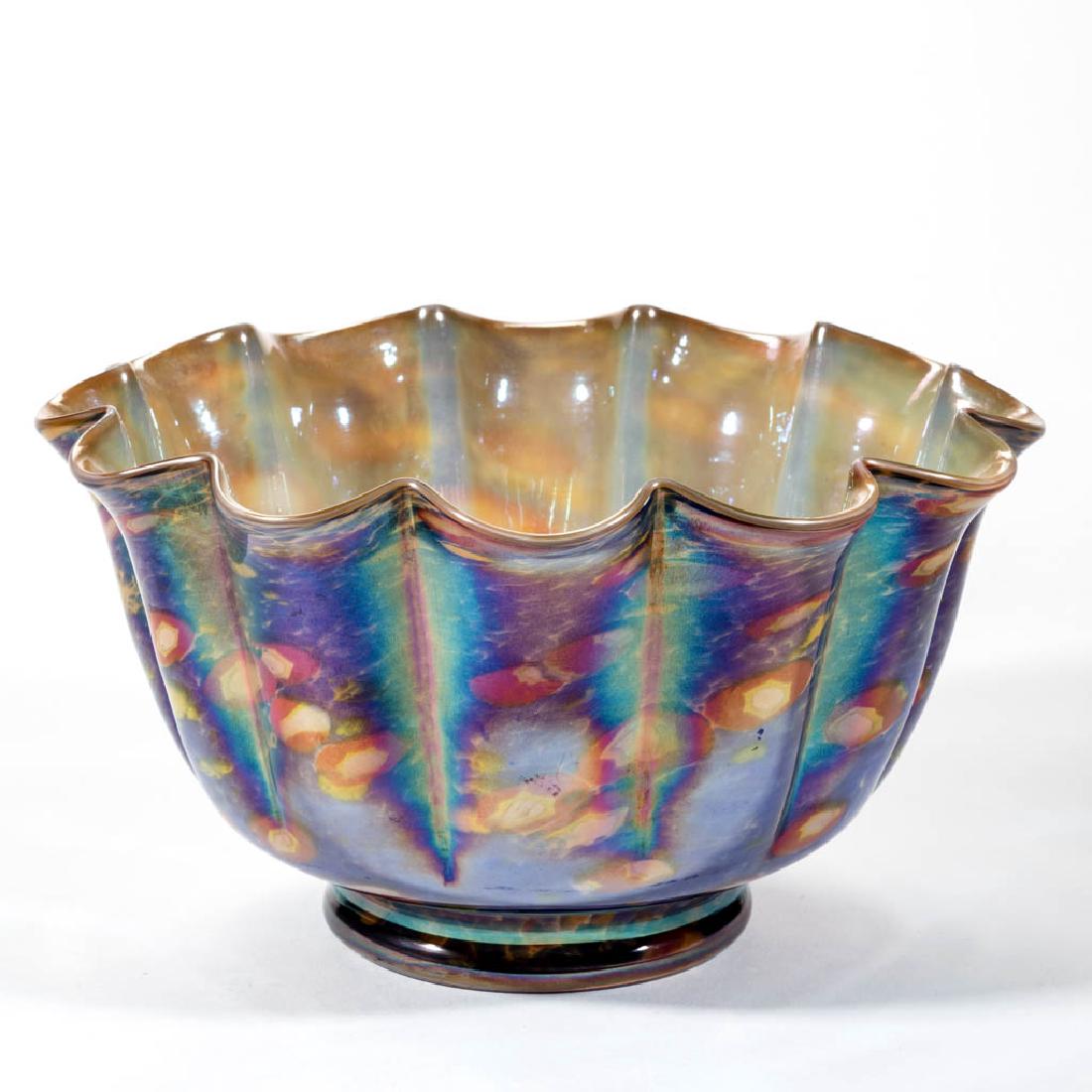 KRALIK MURRINA ART DECO BOWL: KRALIK MURRINA ART DECO BOWL, blue, red, and yellow spatter exterior with iridescent interior, deep form with 12 lobes, polished pontil mark. Czech Republic. Circa 1930. 4 3/4" H, 8 1/4" D.Undamaged.P