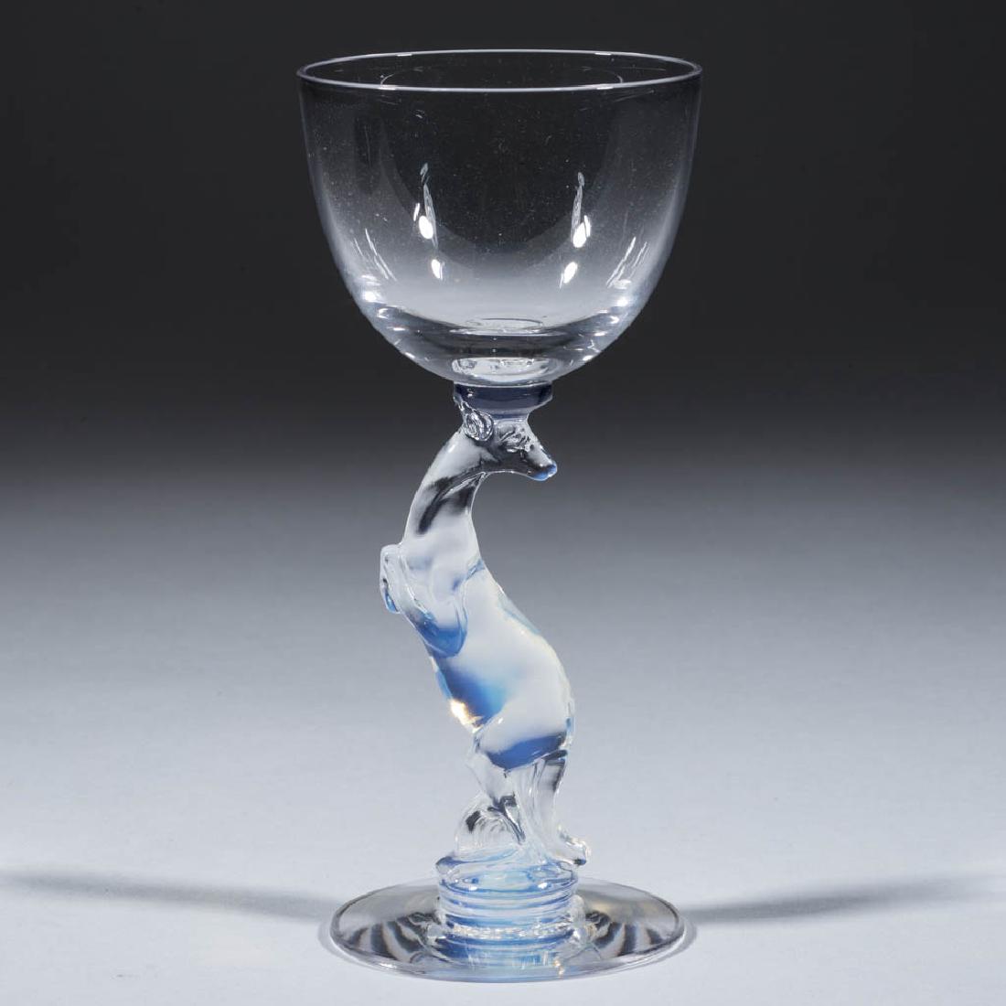 LIBBEY SILHOUETTE COCKTAIL GLASS: LIBBEY SILHOUETTE COCKTAIL GLASS, Moonstone Kangaroo-stem, factory-polished foot with "Libbey" signature to underside. Libbey Glass Co. Second quarter 20th century. 6" H.Undamaged.Literature: Parallel