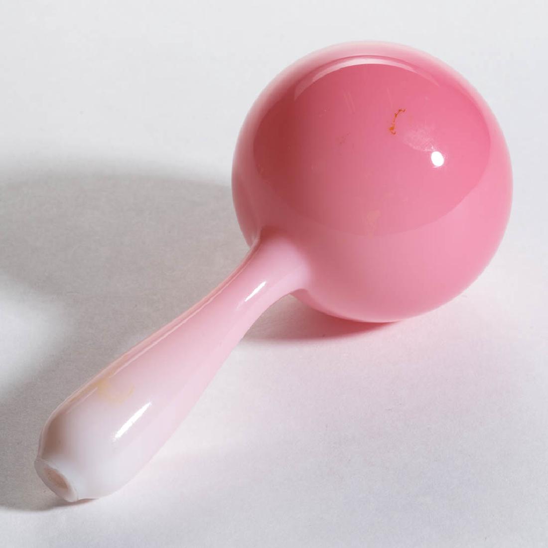 FREE-BLOWN PEACH BLOW DARNING BALL: FREE-BLOWN PEACH BLOW DARNING BALL, polished pontil end. Maker unverified. Fourth quarter 19th century. 5 1/2" LOA. Undamaged. Provenance: From the private collection of Thomas Dimitroff, Corning, NY.
