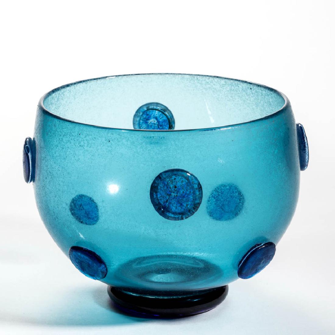 TOM FARBANISH STUDIO ART GLASS BOWL: TOM FARBANISH STUDIO ART GLASS BOWL, blue with cloudy exterior surface simulating ancient glass, with applied disks to body, raised on a disk-like foot with rough pontil mark, signed "TF 97". 1997. 5 