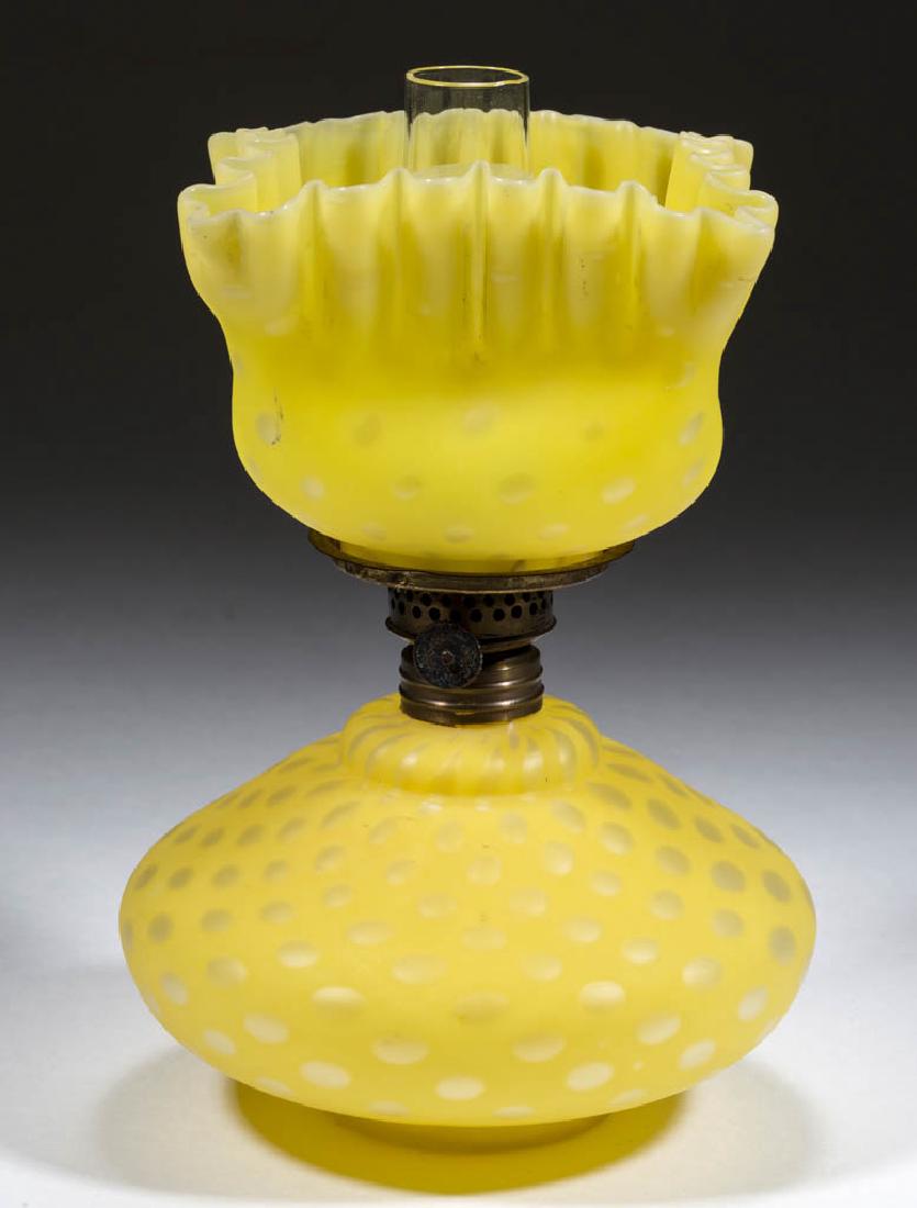 EMPRESS / RAINDROP AIR-TRAP MOTHER-OF-PEARL SATIN: EMPRESS / RAINDROP AIR-TRAP MOTHER-OF-PEARL SATIN MINIATURE LAMP, cased lemon yellow, compressed bulge-form font, matching patterned square-form shade with crimped rim, brass collar. Fitted with a per