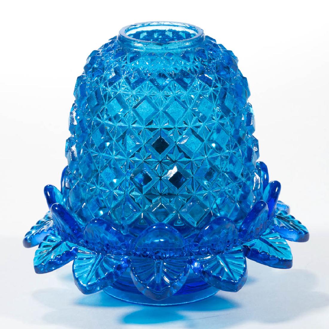 EMBOSSED DIAMOND FAIRY LAMP: EMBOSSED DIAMOND FAIRY LAMP, sapphire blue fairy shade , fitted on a petal-rim lamp cup marked "Rd 176239", integral flower-bowl base with panel pattern, colorless drop-in font. Font fitted with a per