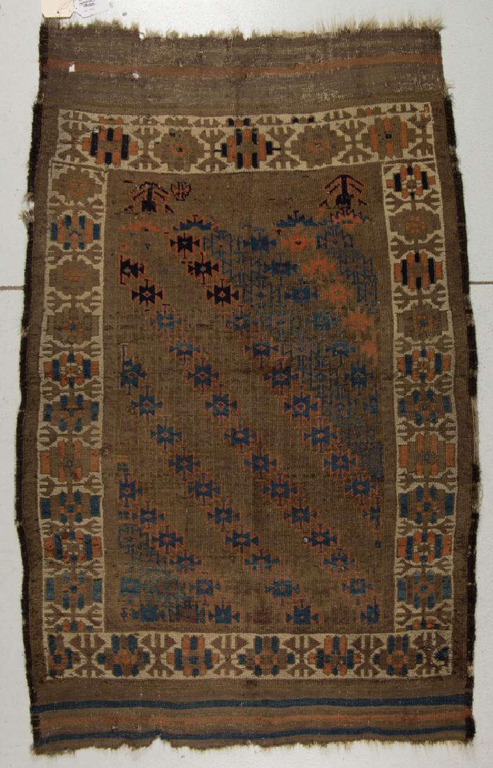 ANTIQUE PERSIAN PRAYER RUG: ANTIQUE PERSIAN PRAYER RUG, brown field with diagonal rows of blue and red guls or crosses, with geometric figures to upper corners, possibly tree of life; cream primary border with brown, blue, and r