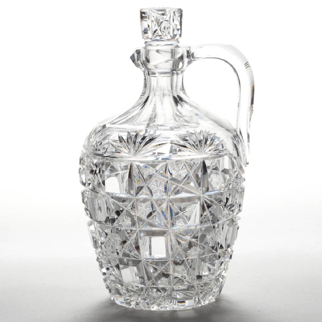 ATTRIBUTED MT. WASHINGTON "NEWTON" BRILLIANT CUT GLASS: ATTRIBUTED MT. WASHINGTON "NEWTON" BRILLIANT CUT GLASS WHISKEY JUG / DECANTER, barrel form, diagonal bands of unpatterned blocks, rayed stars under fans, panel-cut neck with notched edges and a ring s