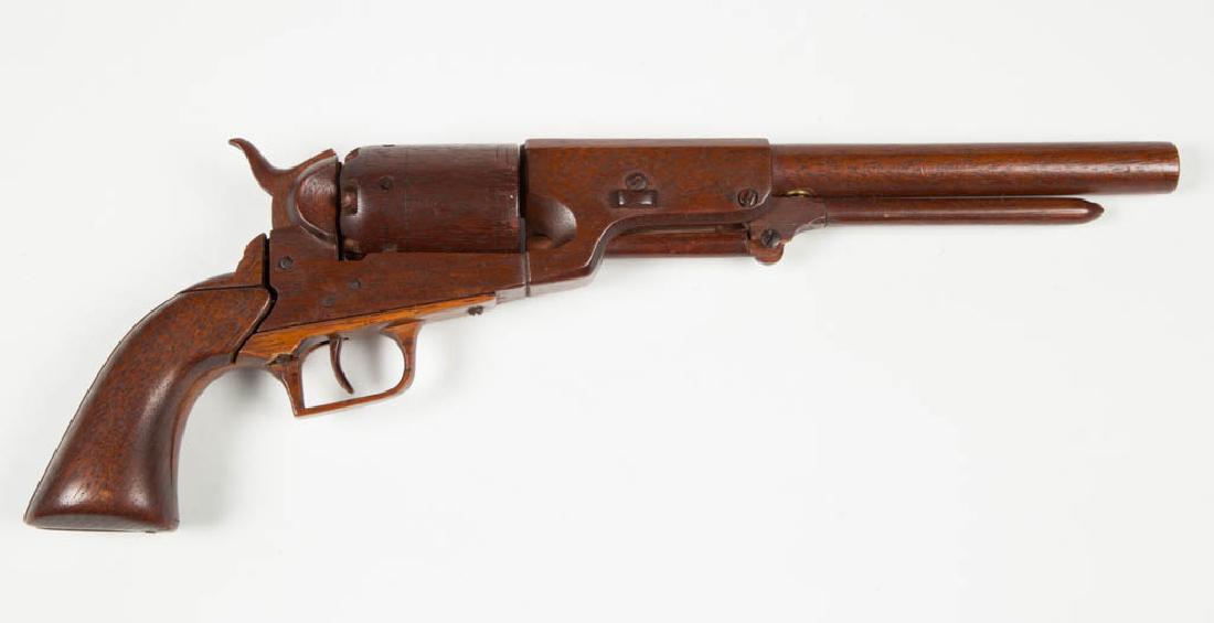 STAUNTON, VIRGINIA ARTISAN-CARVED WOOD REVOLVER MODEL: STAUNTON, VIRGINIA ARTISAN-CARVED WOOD REVOLVER MODEL, near-scale replica of a 19th century revolver, most likely a Colt Walker, with working action including trigger, hammer, and rotating cylinder. C