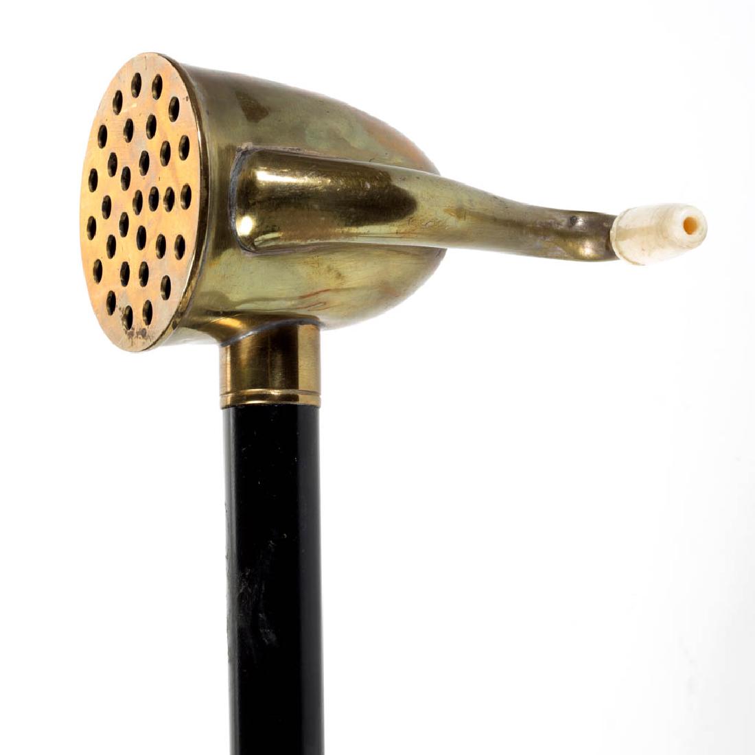 LINDSEY AND SONS (BRITISH) HEARING AID CANE / WALKING: LINDSEY AND SONS (BRITISH) HEARING AID CANE / WALKING STICK, plain tapering ebonized cylindrical shaft fitted with bone tip and brass hearing aid handle, bone ear piece, marked "Lindsey & Sons / Maker