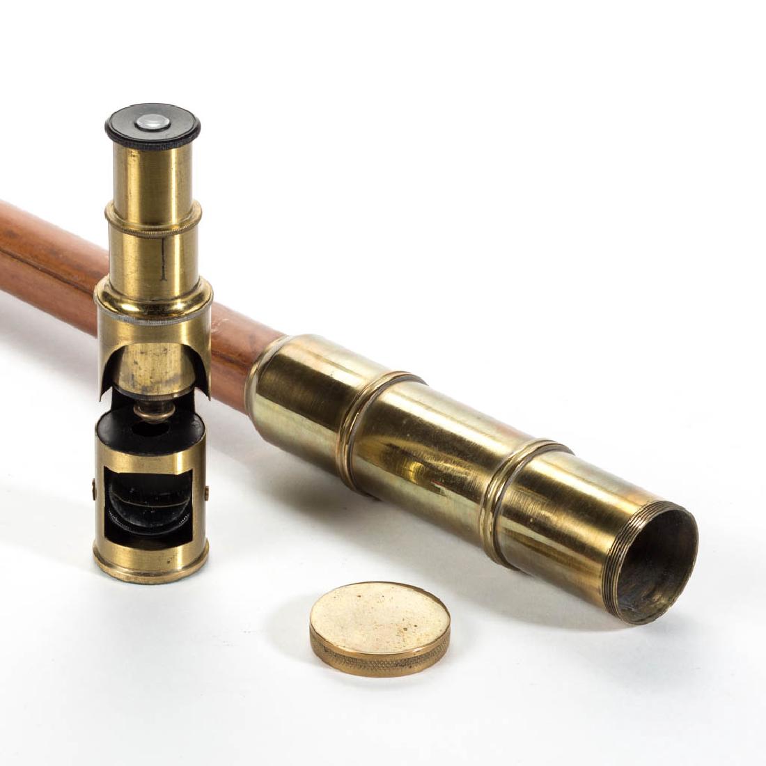 NATURALIST'S MICROSCOPE CANE / WALKING STICK: NATURALIST'S MICROSCOPE CANE / WALKING STICK, plain tapering cylindrical shaft fitted with bone tip and brass handle, concealing a small microscope, no markings located. Late 19th/early 20th century. 