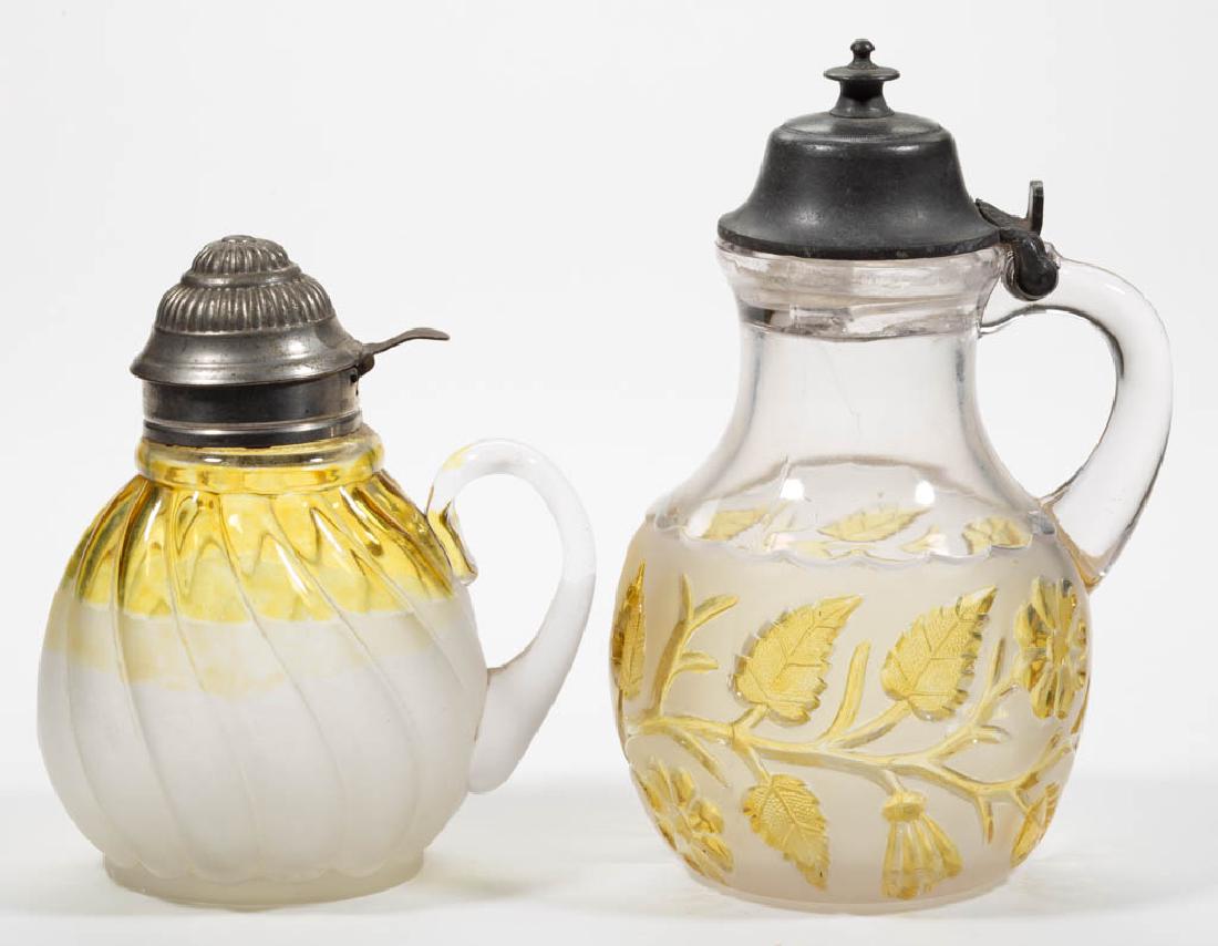 ASSORTED HOBBS AMBER-STAINED GLASS SYRUP PITCHERS, LOT (1 of 1)