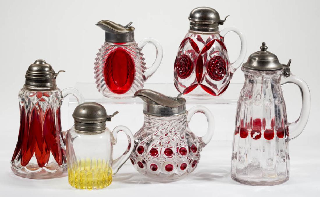 ASSORTED RUBY-STAINED GLASS SYRUP PITCHERS, LOT OF SIX (1 of 1)