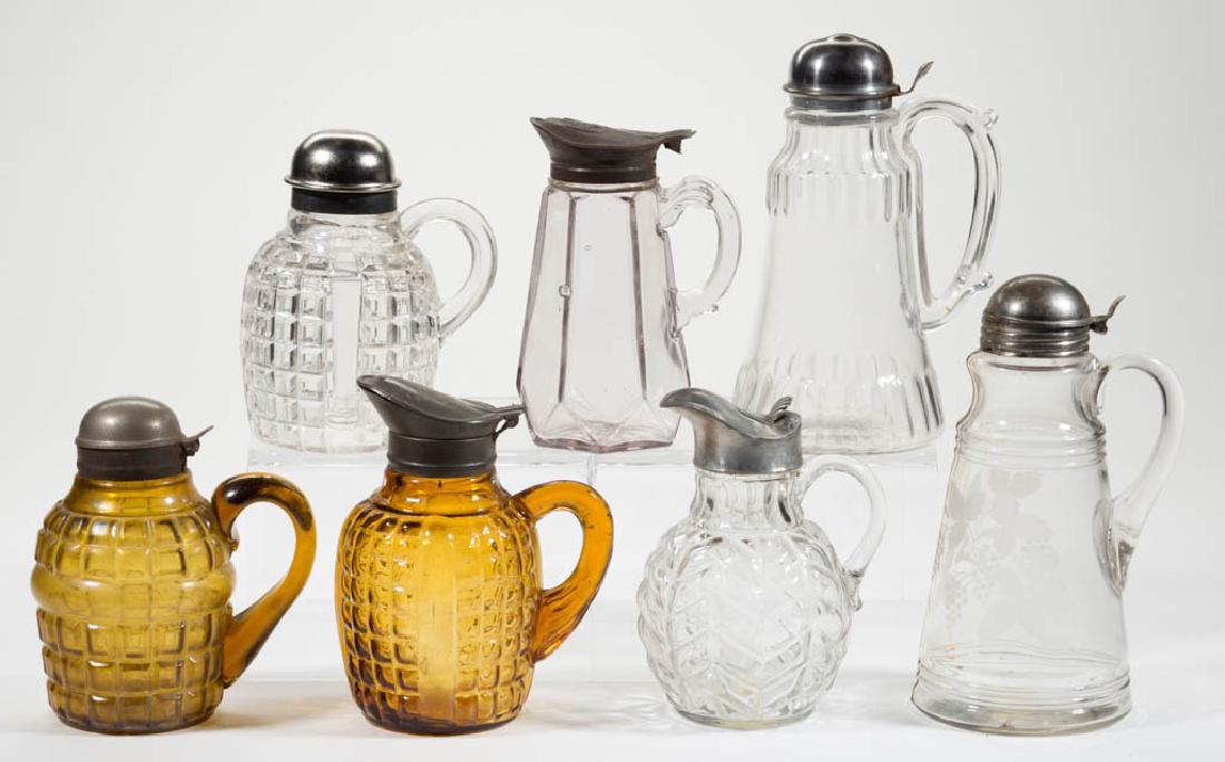 ASSORTED PRESSED GLASS SYRUP PITCHERS, LOT OF SEVEN (1 of 1)