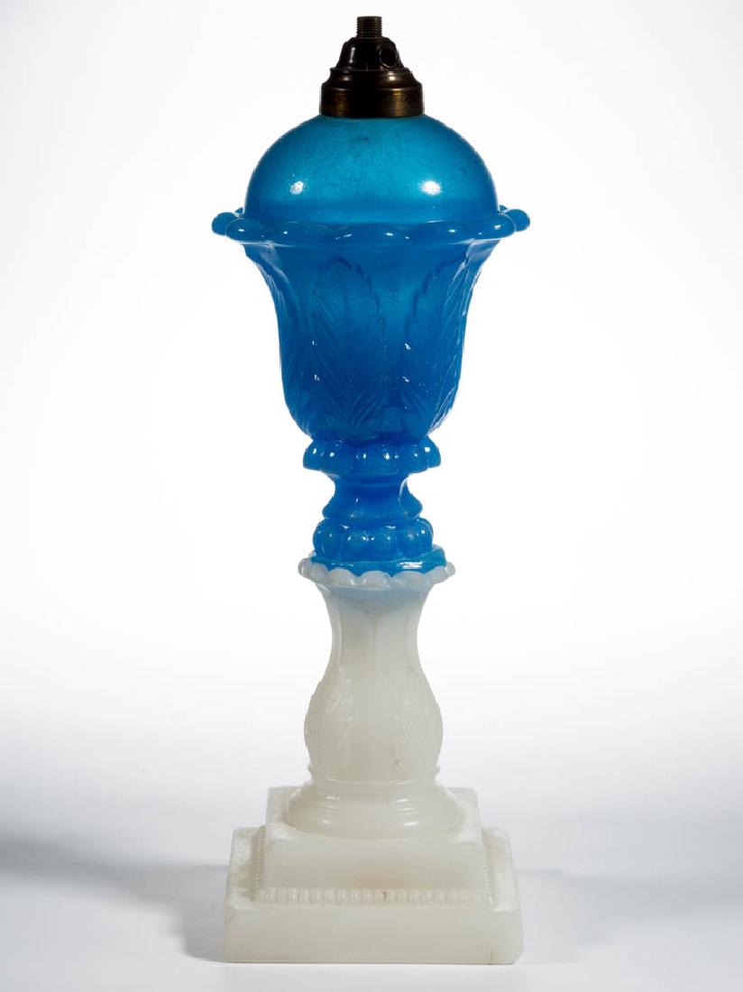 PRESSED ACANTHUS LEAF WHALE OIL / FLUID STAND LAMP: PRESSED ACANTHUS LEAF WHALE OIL / FLUID STAND LAMP, translucent starch blue dome-top font, alabaster/clambroth base, overall lightly sanded surface, large size, 12 protruding petals below the shoulder
