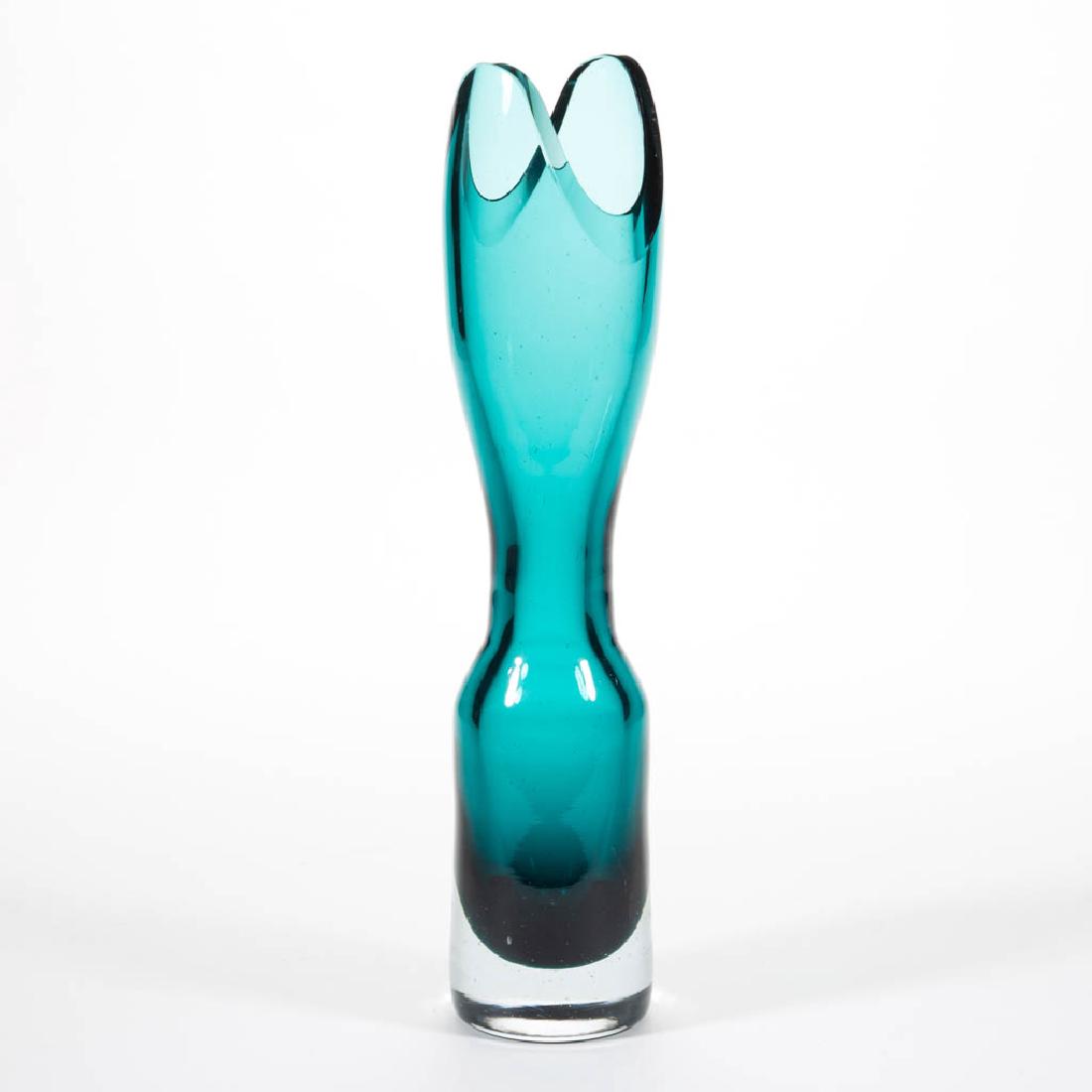 BLENKO NO. 5915-L GLASS - WAYNE HUSTED CASED GLASS VASE: BLENKO NO. 5915-L GLASS - WAYNE HUSTED CASED GLASS VASE, colorless cased teal, factory-polished rim, signed "BLENKO".Circa 1959. 13 1/2" HOA, 2 1/2" D rim.Undamaged with a couple isolated surface scra