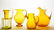 BLENKO JONQUIL AND AMBER GLASS PITCHERS, LOT OF FOUR