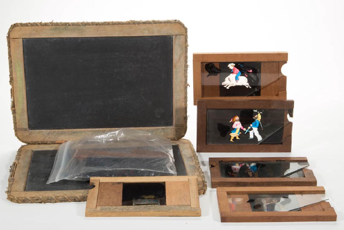 ASSORTED FRAMED CHILD'S ARTICLES, LOT OF SEVEN: ASSORTED FRAMED CHILD'S ARTICLES, LOT OF SEVEN, comprising six Magic Lantern slides, various scenes including a man riding/falling off of a pig and a dentist pulling a man's tooth, a double glass exam