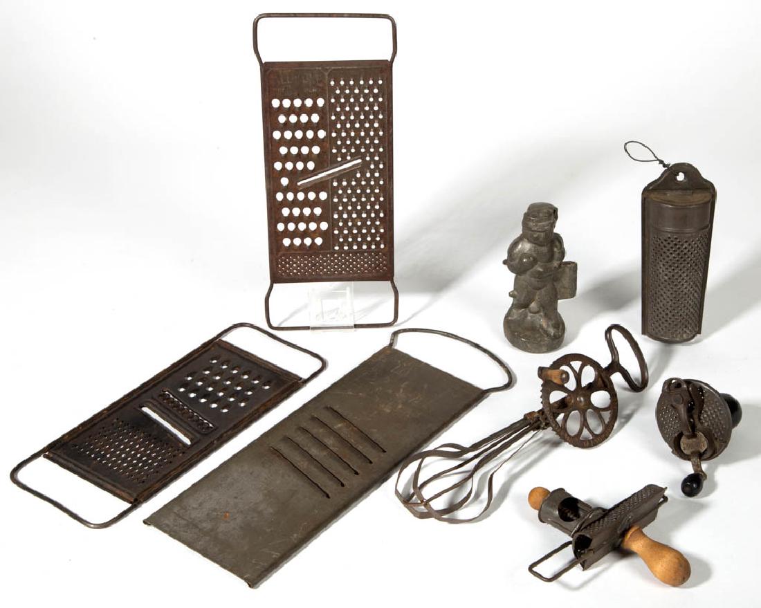 ASSORTED METAL AND WOODEN KITCHEN UTENSILS, LOT OF: ASSORTED METAL AND WOODEN KITCHEN UTENSILS, LOT OF EIGHT, comprising three nutmeg grinders, including a crank example and a "The Edgar" sliding example; three graters; a No. 555 baseball player ice cr