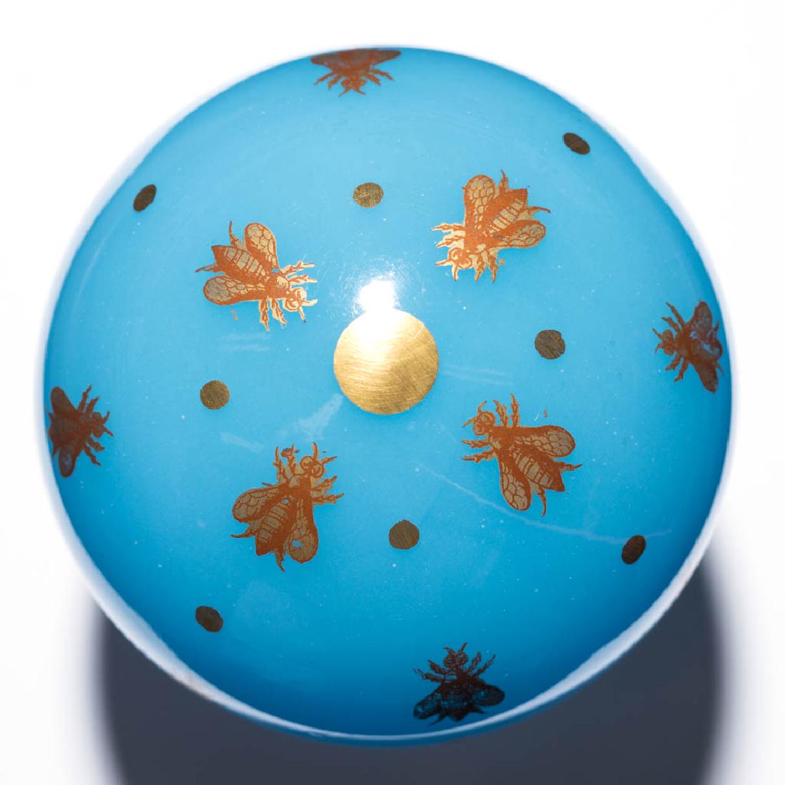 CONTEMPORARY BACCARAT OPALINE AGATE PAPERWEIGHT: CONTEMPORARY BACCARAT OPALINE AGATE PAPERWEIGHT, blue with gilt decoration, design of bees and dots, polished pontil mark, signed "OPALINE AGATE", acid-stamped signature. France. 20th century. 2 3/4"